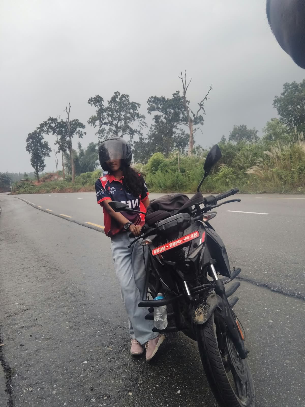 Khushbu wearing her Nepal jersey outdoors
